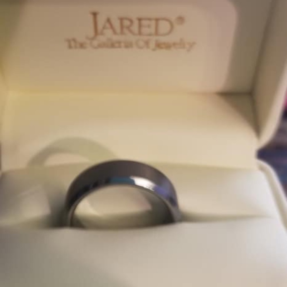 Brand new size 10 tungsten wedding band.